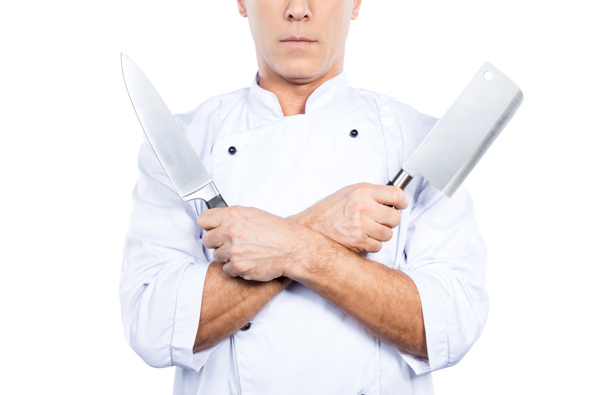 Chef che mostra una tecnica di taglio